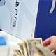 a person buying a ps5 with yen in japan - where to buy a ps5